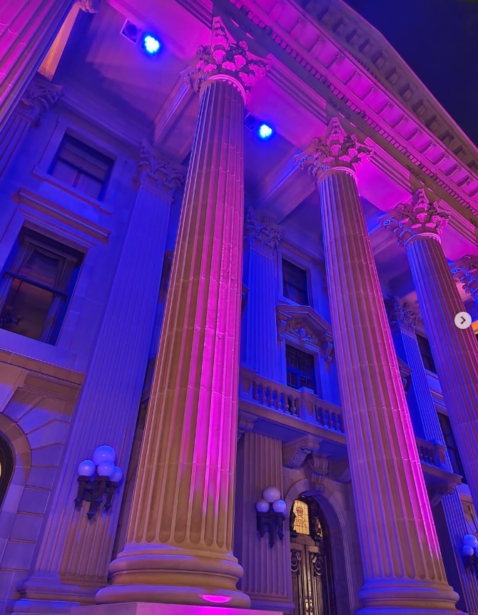 A building lit up in purple in celebration of disability employment awareness month